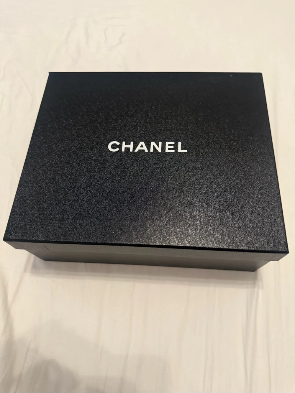CHANEL Black Braided Slides with Gold Chain Accents